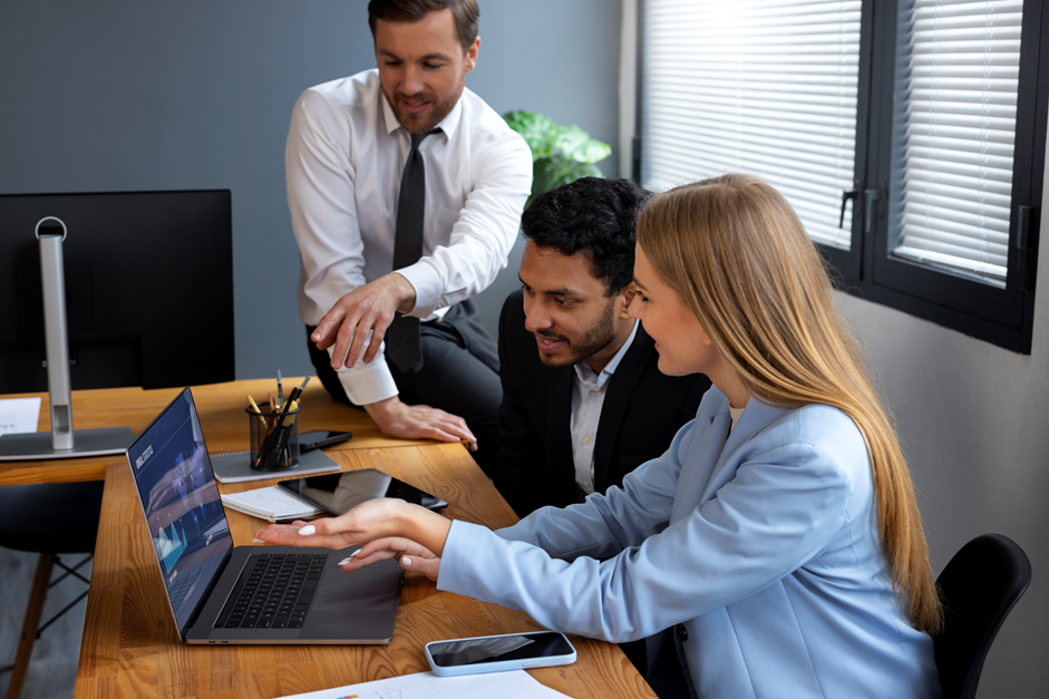 Image of people discussing a dashboard